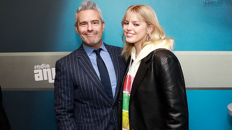 Andy Cohen standing with Renee Rapp