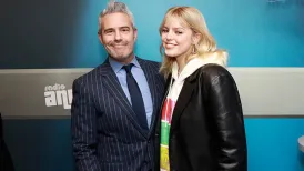 Andy Cohen standing with Renee Rapp